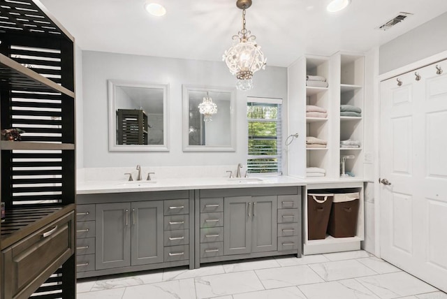 139 Parnassus Cir, Oceanside, CA 92054 - bathroom featuring marble finish floors, double vanity, and a chandelier