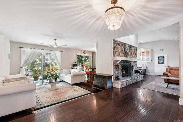 139 Parnassus Cir, Oceanside, CA 92054 - living area with wood-type flooring, ceiling fan, a stone fireplace, a chandelier, and vaulted ceiling