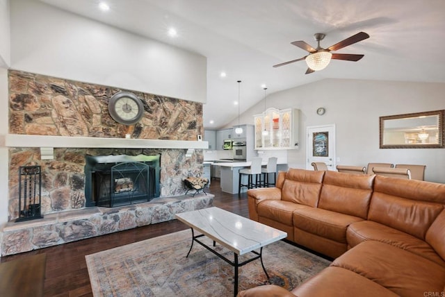 139 Parnassus Cir, Oceanside, CA 92054 - living room featuring lofted ceiling, a ceiling fan, dark wood finished floors, a stone fireplace, and recessed lighting