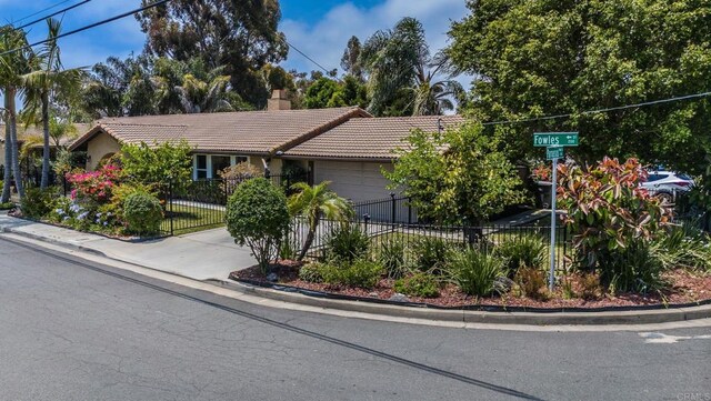 139 Parnassus Cir, Oceanside, CA 92054 - view of front of property with a tiled roof, a garage, a chimney, concrete driveway, and stucco siding