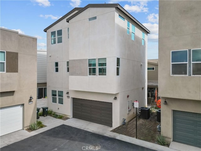 27422 Pioneer Ct, Valencia, CA 91381 - view of front of property with a garage and stucco siding
