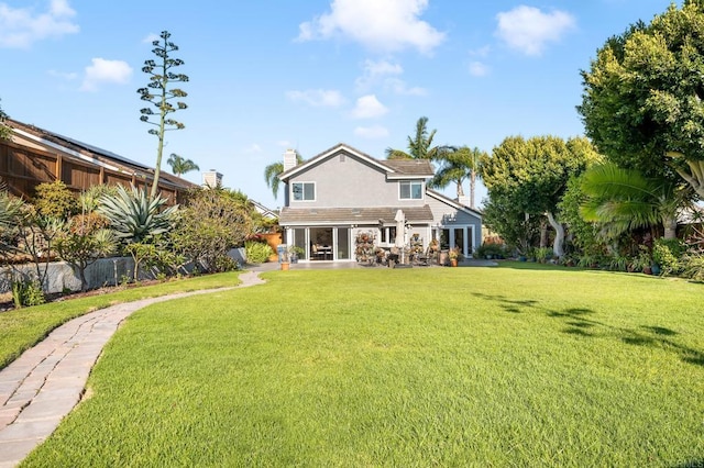 1592 Hawk View Dr, Encinitas, CA 92024 - rear view of property featuring a yard, a chimney, and stone siding