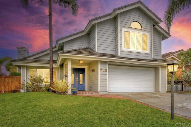 1592 Hawk View Dr, Encinitas, CA 92024 - traditional home featuring a garage, concrete driveway, a tile roof, and a chimney