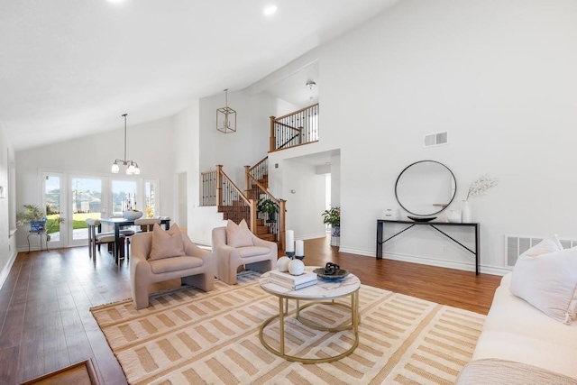 1592 Hawk View Dr, Encinitas, CA 92024 - living area featuring a chandelier, wood finished floors, stairway, and high vaulted ceiling