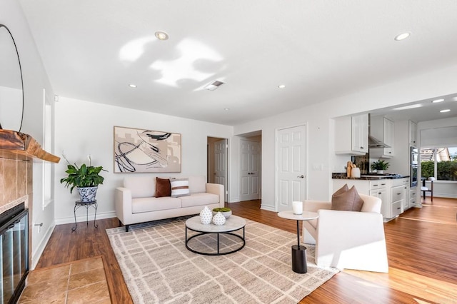 1592 Hawk View Dr, Encinitas, CA 92024 - living room featuring light wood-style floors, a tile fireplace, and recessed lighting