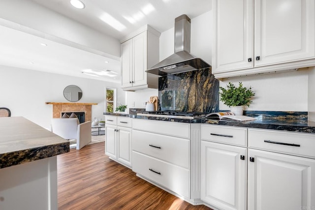 1592 Hawk View Dr, Encinitas, CA 92024 - kitchen featuring wall chimney exhaust hood, white cabinetry, stainless steel gas cooktop, and recessed lighting