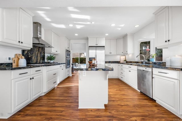 1592 Hawk View Dr, Encinitas, CA 92024 - kitchen with appliances with stainless steel finishes, wall chimney range hood, dark wood finished floors, white cabinetry, and recessed lighting