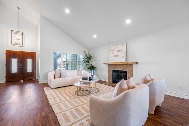 1592 Hawk View Dr, Encinitas, CA 92024 - living area featuring high vaulted ceiling, wood finished floors, a tile fireplace, a chandelier, and recessed lighting