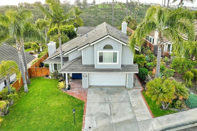 1592 Hawk View Dr, Encinitas, CA 92024 - view of front of property with a garage, driveway, a chimney, and a shingled roof