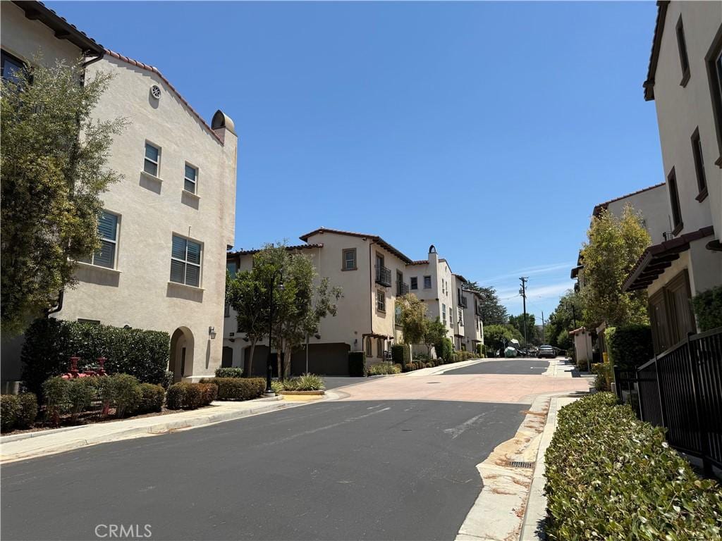 11840 Nixon Ln, Whittier, CA 90601 - view of asphalt street with curbs, a residential view, and sidewalks
