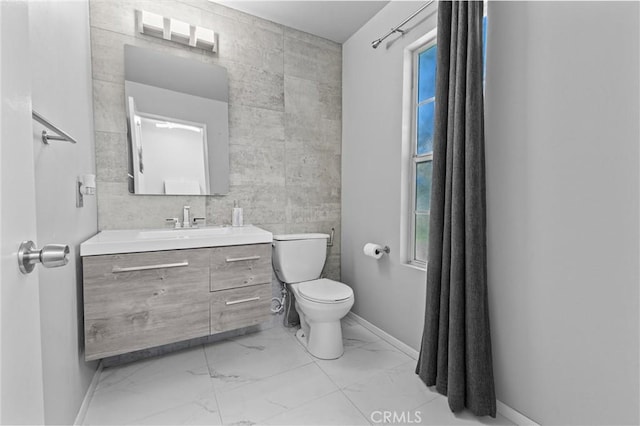 1142 Juniper Ct, San Jacinto, CA 92582 - bathroom featuring marble finish floors, vanity, and tile walls