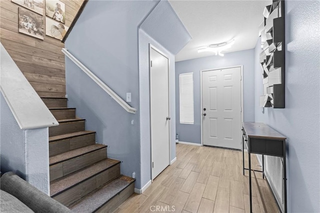 1142 Juniper Ct, San Jacinto, CA 92582 - entrance foyer with light wood-type flooring and stairway