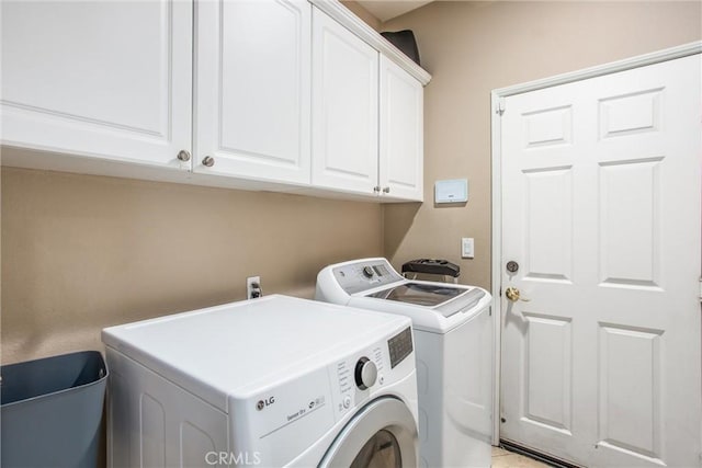 83315 Stagecoach Rd, Indio, CA 92203 - laundry room featuring washing machine and dryer and cabinet space