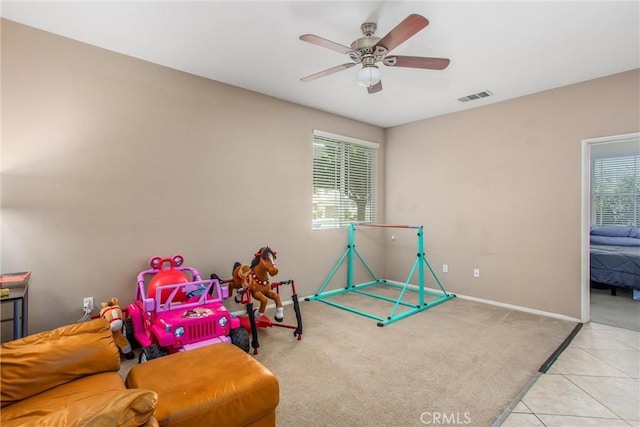 83315 Stagecoach Rd, Indio, CA 92203 - playroom with carpet, a ceiling fan, and tile patterned floors