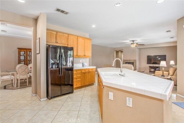 83315 Stagecoach Rd, Indio, CA 92203 - kitchen featuring black fridge, a ceiling fan, light tile patterned floors, and recessed lighting