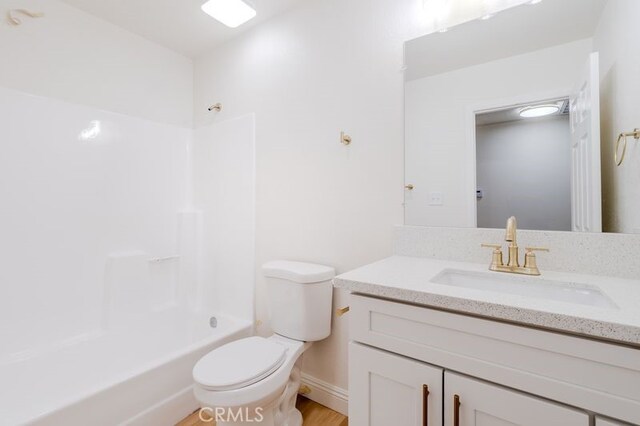 16233 Manzanita St, Hesperia, CA 92345 - full bathroom with vanity, bathtub / shower combination, and wood finished floors
