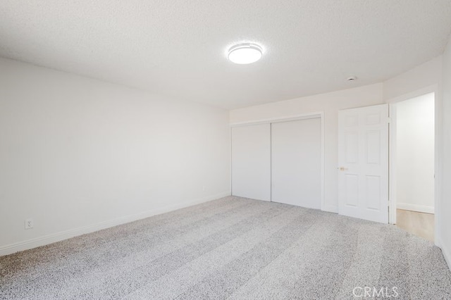 16233 Manzanita St, Hesperia, CA 92345 - unfurnished bedroom featuring carpet floors, a closet, and a textured ceiling