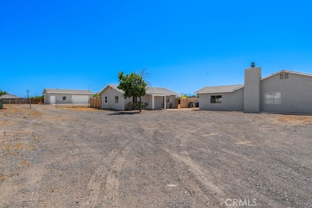 16233 Manzanita St, Hesperia, CA 92345 - back of house featuring a chimney
