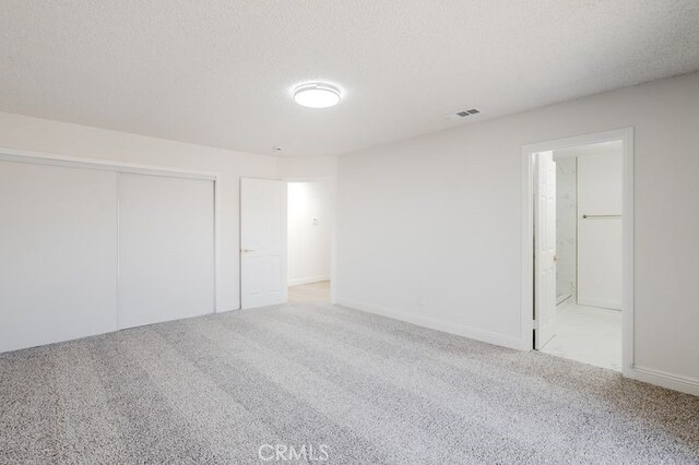 16233 Manzanita St, Hesperia, CA 92345 - unfurnished bedroom featuring carpet, a closet, and ensuite bath