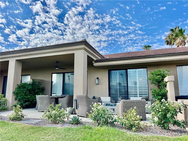 76376 Sweet Pea Way, Palm Desert, CA 92211 - property entrance with a ceiling fan, a patio area, and stucco siding