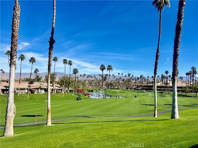 76376 Sweet Pea Way, Palm Desert, CA 92211 - surrounding community with golf course view, a water and mountain view, and a lawn
