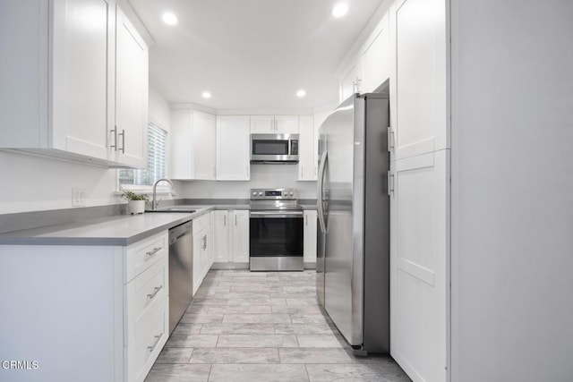 2940 N Verdugo Rd Unit 411, Glendale, CA 91208 - kitchen featuring stainless steel appliances, recessed lighting, white cabinets, light countertops, and light wood-type flooring
