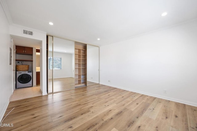 2940 N Verdugo Rd Unit 411, Glendale, CA 91208 - unfurnished bedroom featuring washer / dryer, ornamental molding, wood finished floors, recessed lighting, and a closet