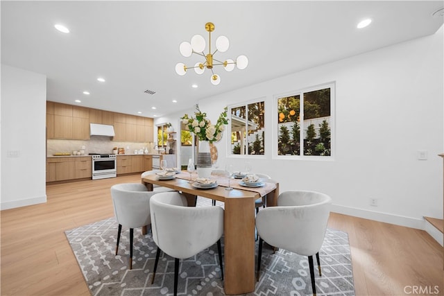 33 Winterfield Rd, Irvine, CA 92602 - dining space featuring light wood finished floors, recessed lighting, and a chandelier