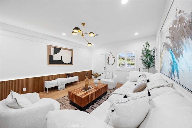 33 Winterfield Rd, Irvine, CA 92602 - living area with wood finished floors, a chandelier, recessed lighting, a wainscoted wall, and wood walls