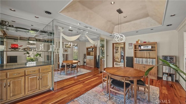 4968 Chapala Dr, Riverside, CA 92507 - dining area featuring light wood-type flooring, a raised ceiling, a chandelier, ornamental molding, and recessed lighting
