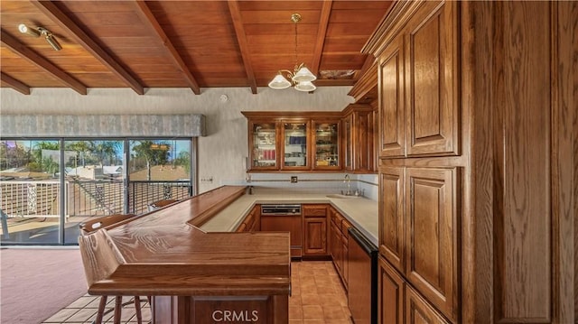 4968 Chapala Dr, Riverside, CA 92507 - kitchen featuring a wooden ceiling with exposed beams, dishwasher, a chandelier, brown cabinetry, and light countertops