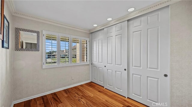 4968 Chapala Dr, Riverside, CA 92507 - unfurnished bedroom with crown molding, wood finished floors, a closet, and recessed lighting
