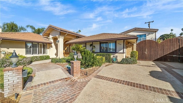 4968 Chapala Dr, Riverside, CA 92507 - single story home with a gate, stucco siding, and a tiled roof