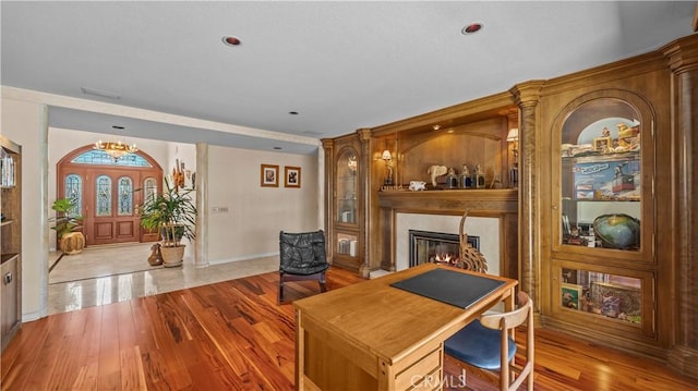 4968 Chapala Dr, Riverside, CA 92507 - home office featuring a glass covered fireplace, wood finished floors, a chandelier, and recessed lighting