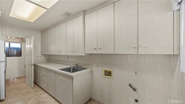 4968 Chapala Dr, Riverside, CA 92507 - washroom featuring washer hookup, hookup for an electric dryer, and cabinet space