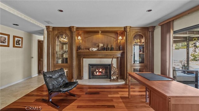 4968 Chapala Dr, Riverside, CA 92507 - sitting room featuring a glass covered fireplace, recessed lighting, and wood finished floors
