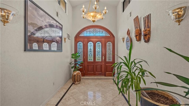 4968 Chapala Dr, Riverside, CA 92507 - entryway featuring a chandelier, inlaid floor details, and a high ceiling