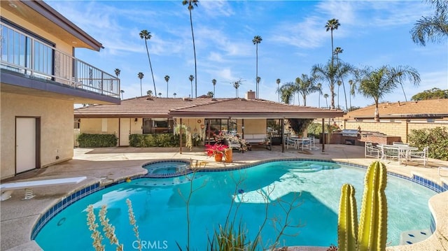 4968 Chapala Dr, Riverside, CA 92507 - view of pool featuring a patio area, area for grilling, a diving board, and a pool with connected hot tub