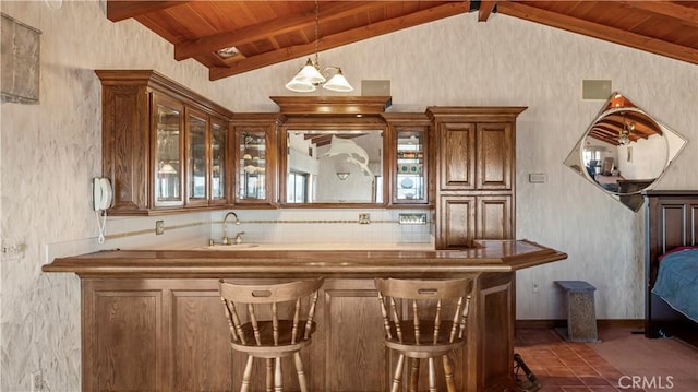 4968 Chapala Dr, Riverside, CA 92507 - bar area featuring dark tile patterned floors, pendant lighting, and wooden ceiling