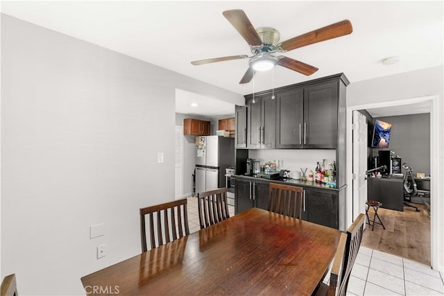 629 E 93rd St, Los Angeles, CA 90002 - dining area with light tile patterned floors, a ceiling fan, and a desk