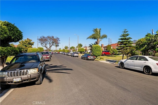 629 E 93rd St, Los Angeles, CA 90002 - view of asphalt street with street lights and sidewalks