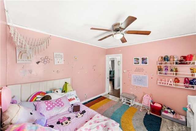 629 E 93rd St, Los Angeles, CA 90002 - bedroom with wood finished floors, crown molding, and ceiling fan