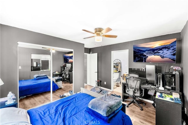 629 E 93rd St, Los Angeles, CA 90002 - bedroom with a desk, wood finished floors, a closet, and ceiling fan