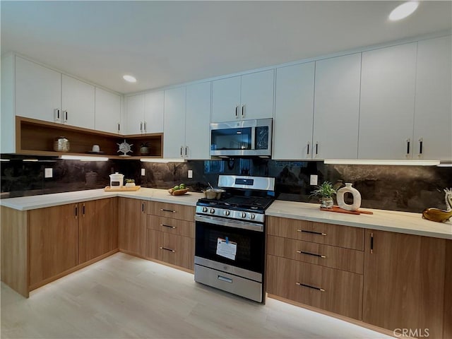 1319 Riedel Ave, Fullerton, CA 92831 - kitchen featuring stainless steel appliances, light flooring, backsplash, open shelves, and white cabinetry