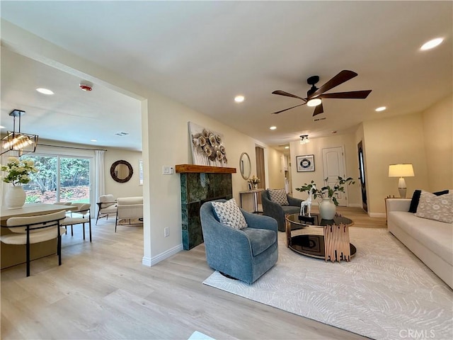 1319 Riedel Ave, Fullerton, CA 92831 - living room with light wood-style flooring, a ceiling fan, recessed lighting, and a tiled fireplace