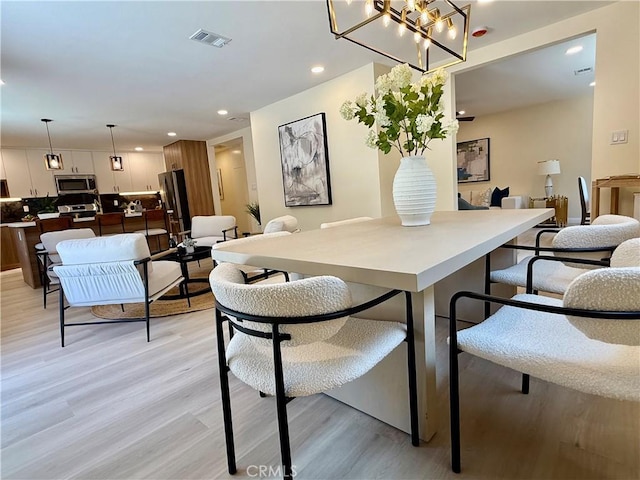 1319 Riedel Ave, Fullerton, CA 92831 - dining room featuring light wood-style floors, recessed lighting, and a chandelier