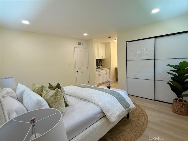 1319 Riedel Ave, Fullerton, CA 92831 - bedroom featuring light wood finished floors, recessed lighting, and ensuite bath