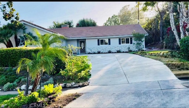 1319 Riedel Ave, Fullerton, CA 92831 - single story home featuring stucco siding, driveway, a tile roof, and a chimney
