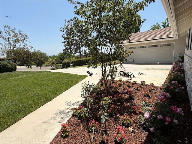 1319 Riedel Ave, Fullerton, CA 92831 - view of grassy yard featuring an attached garage and driveway
