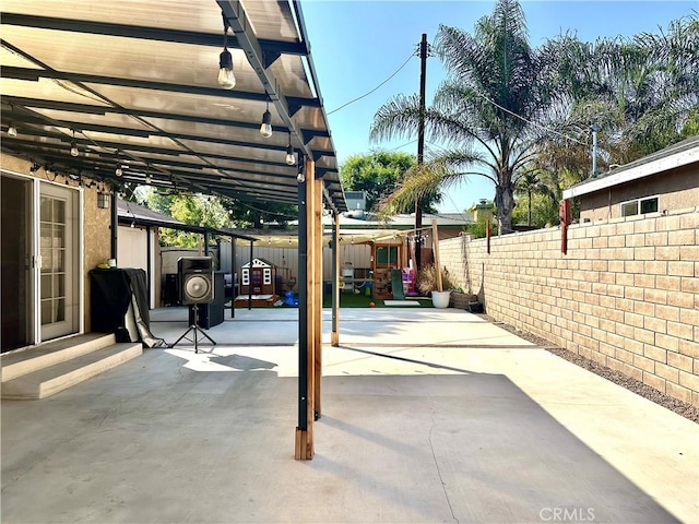 14811 Alexander St, San Fernando, CA 91345 - fenced backyard featuring a patio area and a pergola